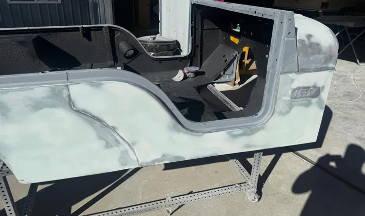Jeep CJ tub bodywork, filler and primer on the rotisserie